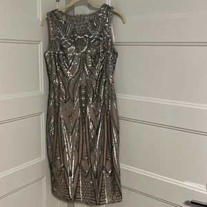 Calvin Klein tight silver sequined with darker beige slip underneath in size 4